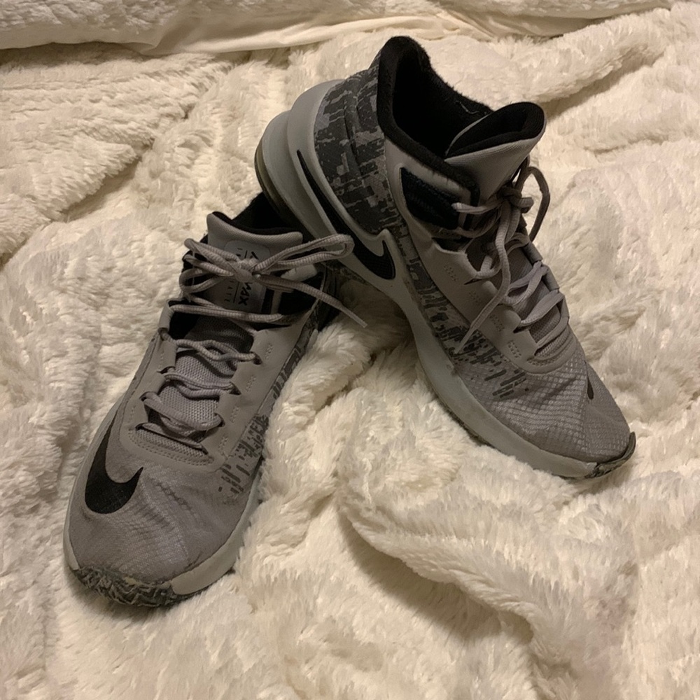 Gray Nike air max infuriate used as basketball shoes have  tears in material